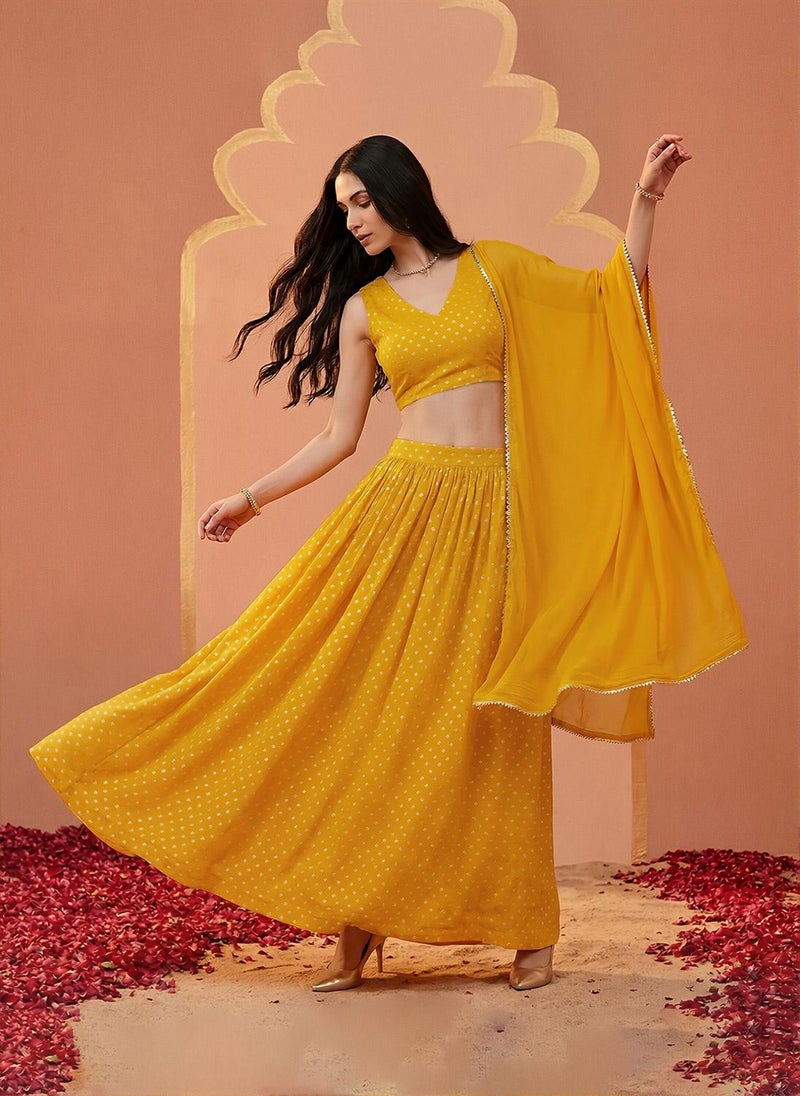 Globus Women Mustard V-Neck Bandhani Print Crop Top with Flared Hem Skirt & Dupatta Festive Co-Ord Set - Image 1
